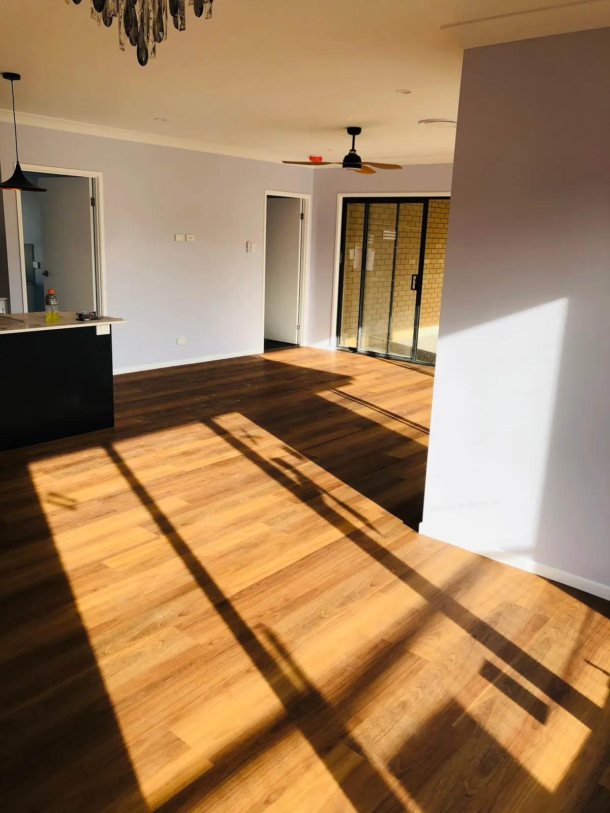 Hybrid floor in a living and dining area with afternoon light