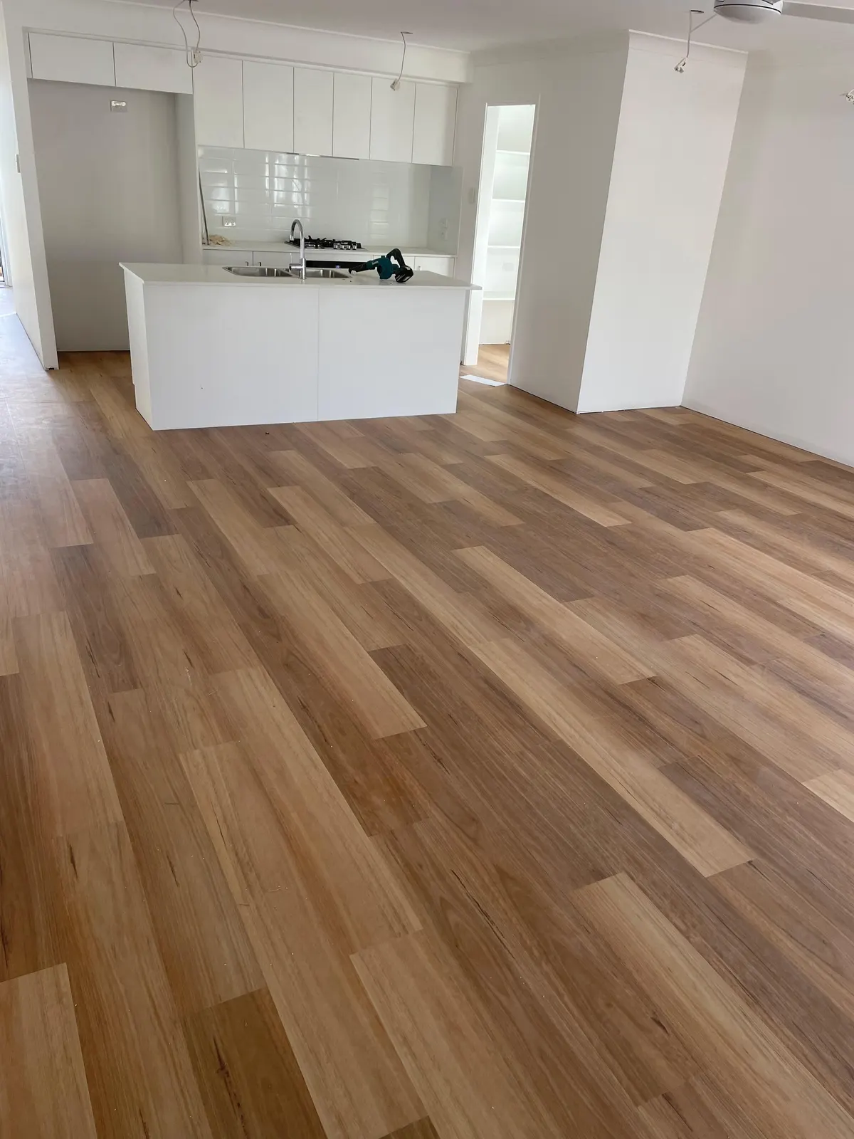 Hybrid floor through an open-plan kitchen and living area