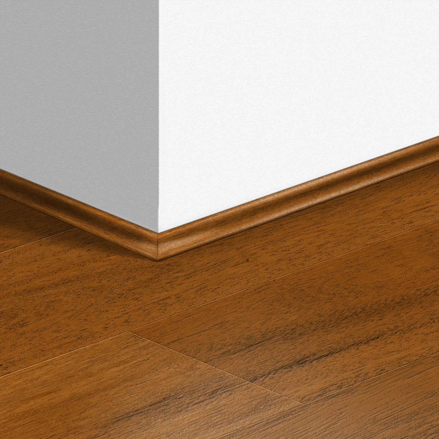 Timber-coloured scotia trim finishing the floor perimeter