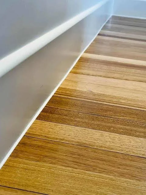 Neat finishing detail at the edge of timber flooring
