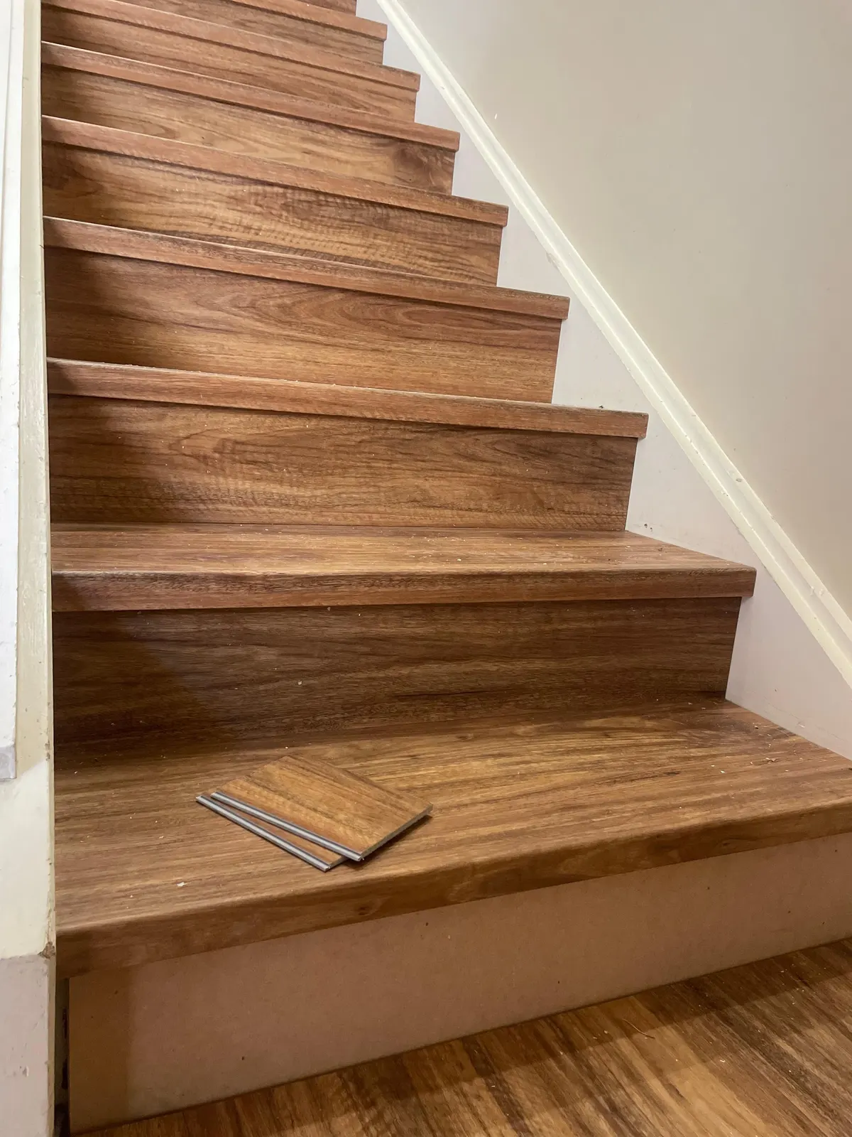 Timber treads and risers being installed on a staircase