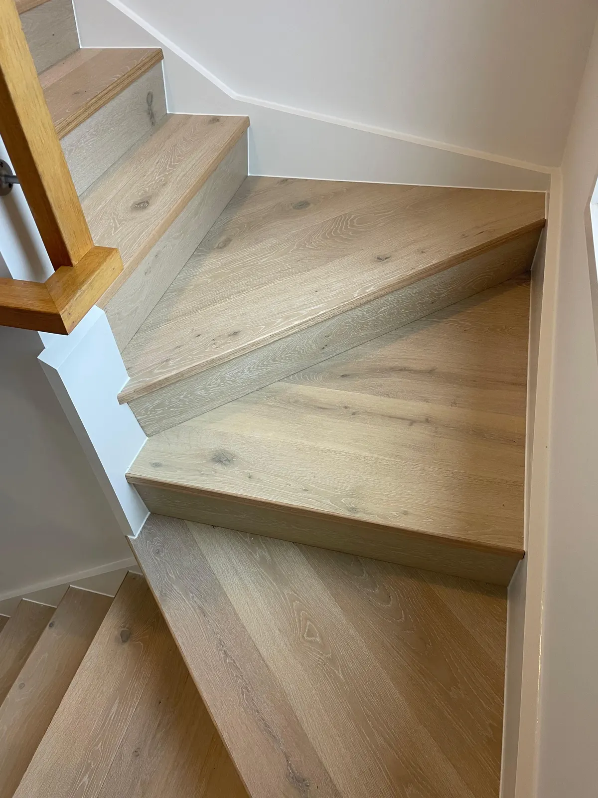 Timber treads and risers on a winder staircase